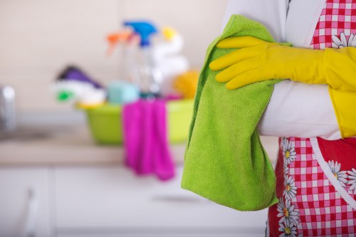 Kitchen surfaces being cleaned during a Docklands move-in clean