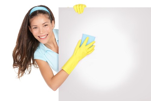 Steam cleaning a carpeted room in a modern Docklands apartment